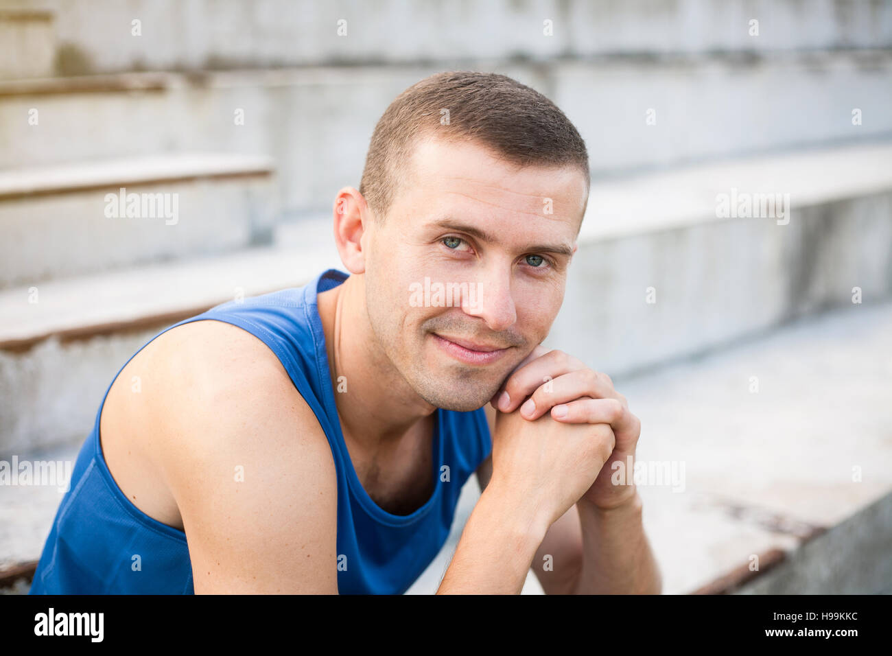 Portrait of a young man in a blue shirt closeup. Stock Photo