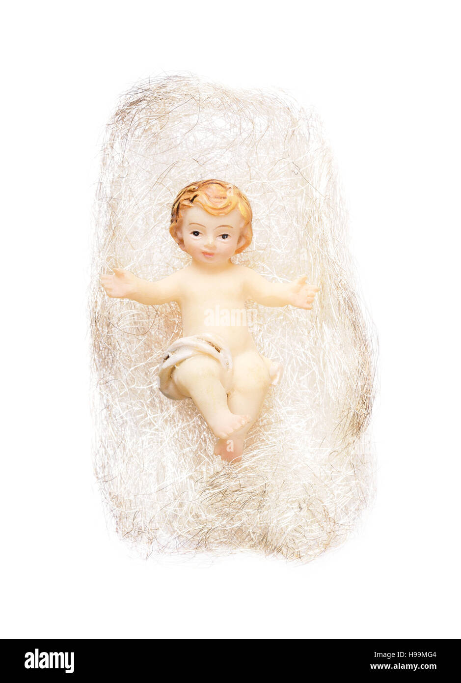 Christ child figurine in angel hair on white background. Handcrafted Child Jesus Christmas tree decoration. Stock Photo
