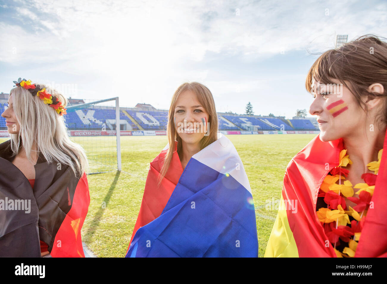 Female soccer fans with different national flags Stock Photo Alamy