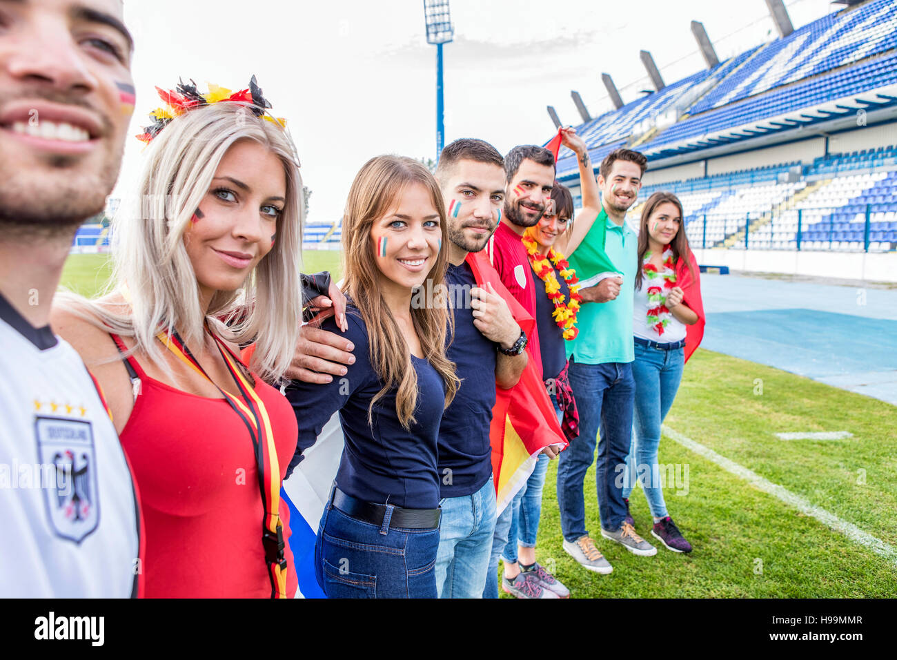 Group of fans on soccer field Stock Photo Alamy