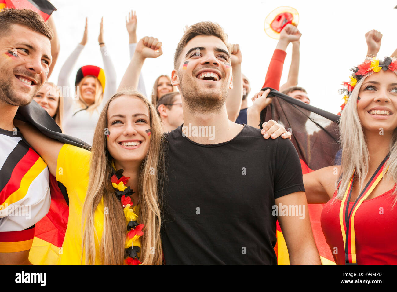 Group of German soccer fans cheering Stock Photo