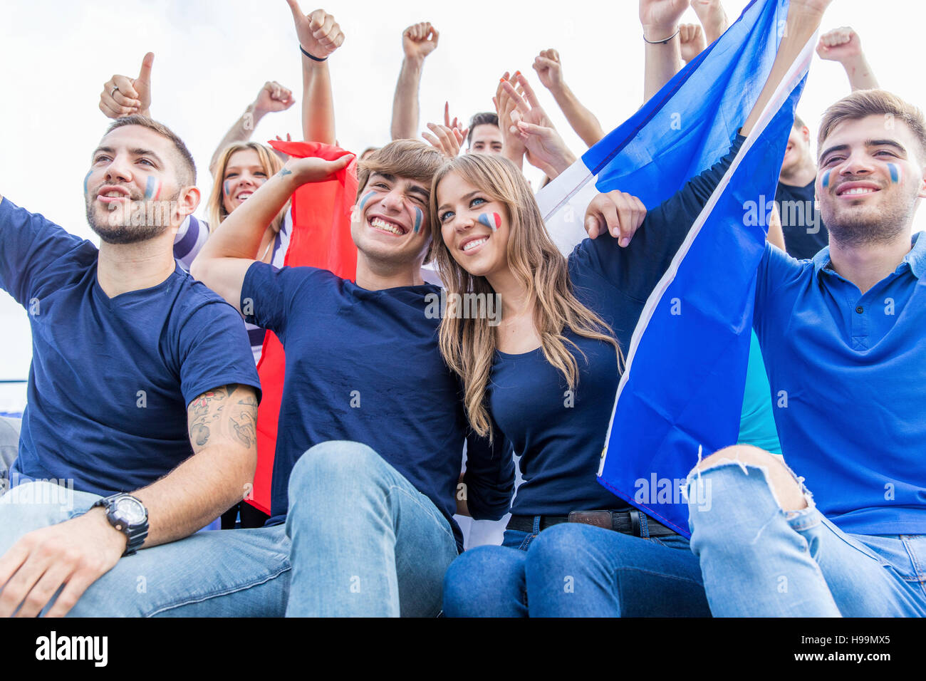 Group of soccer fans cheering and shouting Stock Photo Alamy
