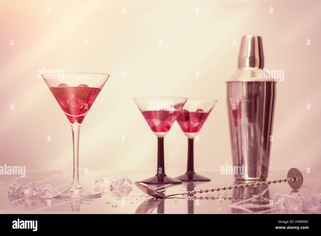 Mixing cocktails in Art Deco glasses over crushed ice Stock Photo Alamy
