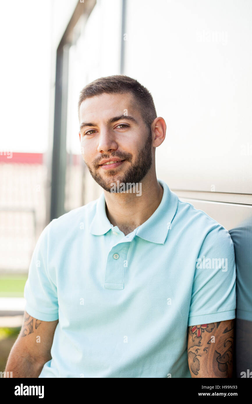 Portrait of male nurse with brown hair outdoors Stock Photo