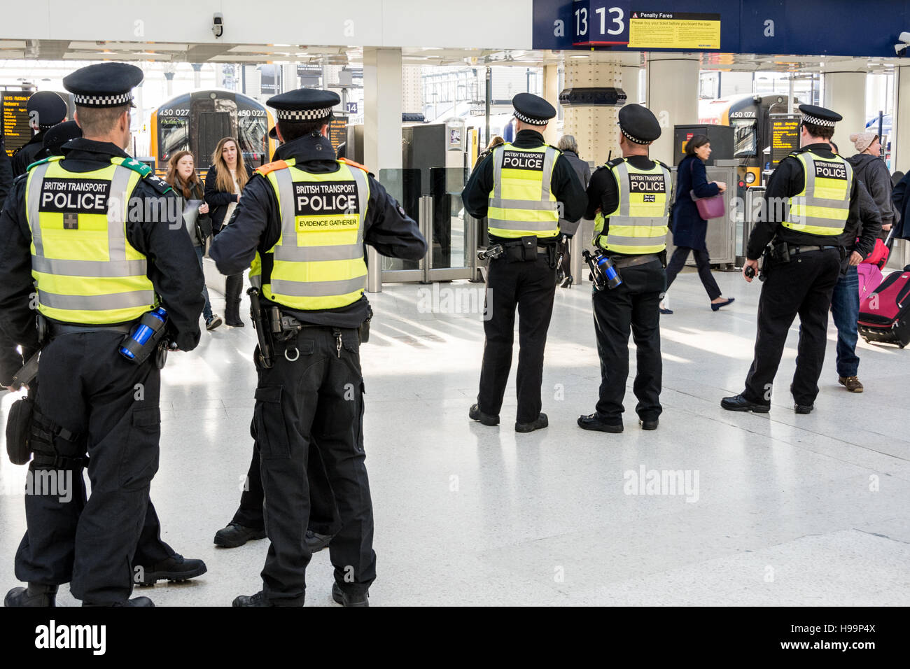 British Transport Police waiting for Scottish football supporters at Waterloo Station in London, England, UK Stock Photo