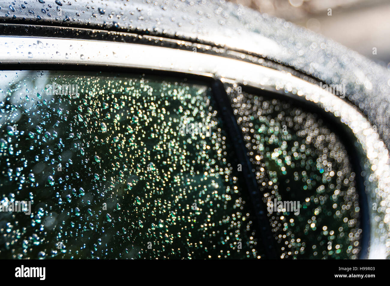 Rain droplets on a Jaguar XF's rear window Stock Photo Alamy