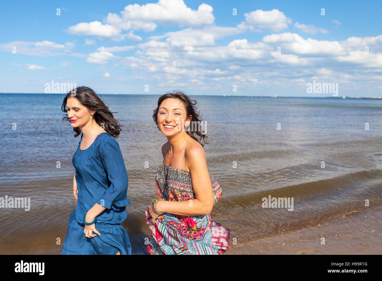 Two women walking beach beach hi-res stock photography and images - Alamy