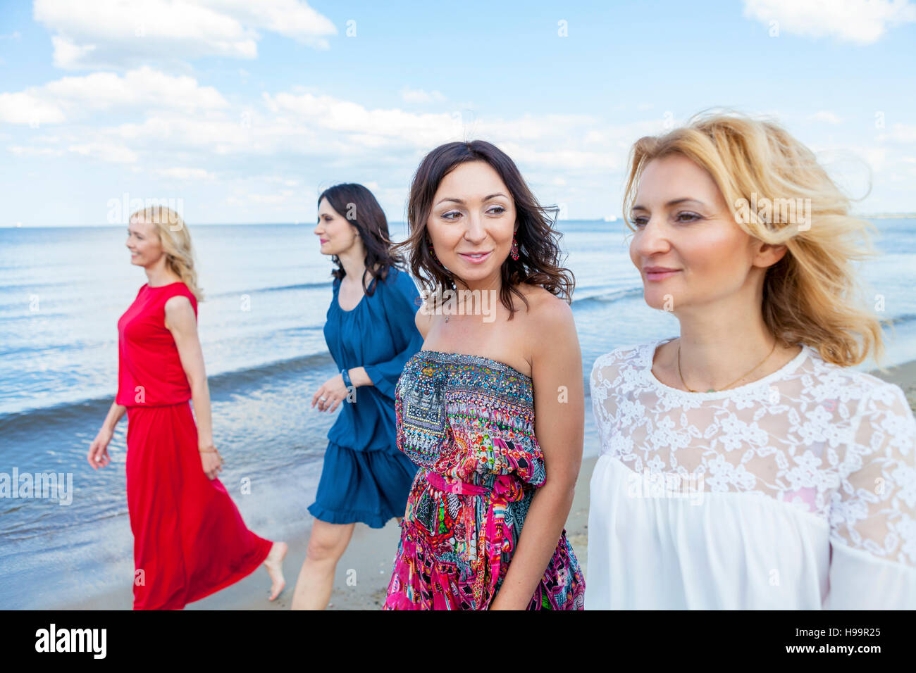 Group women beach walking mature hi-res stock photography and images
