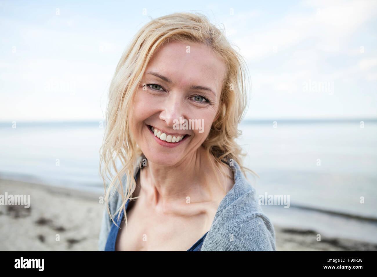 Mature woman beach wind hi-res stock photography and images - Alamy