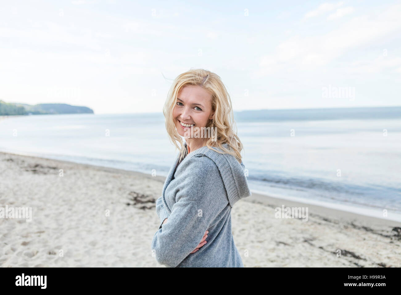 Portrait of woman with blond hair on beach Stock Photo - Alamy