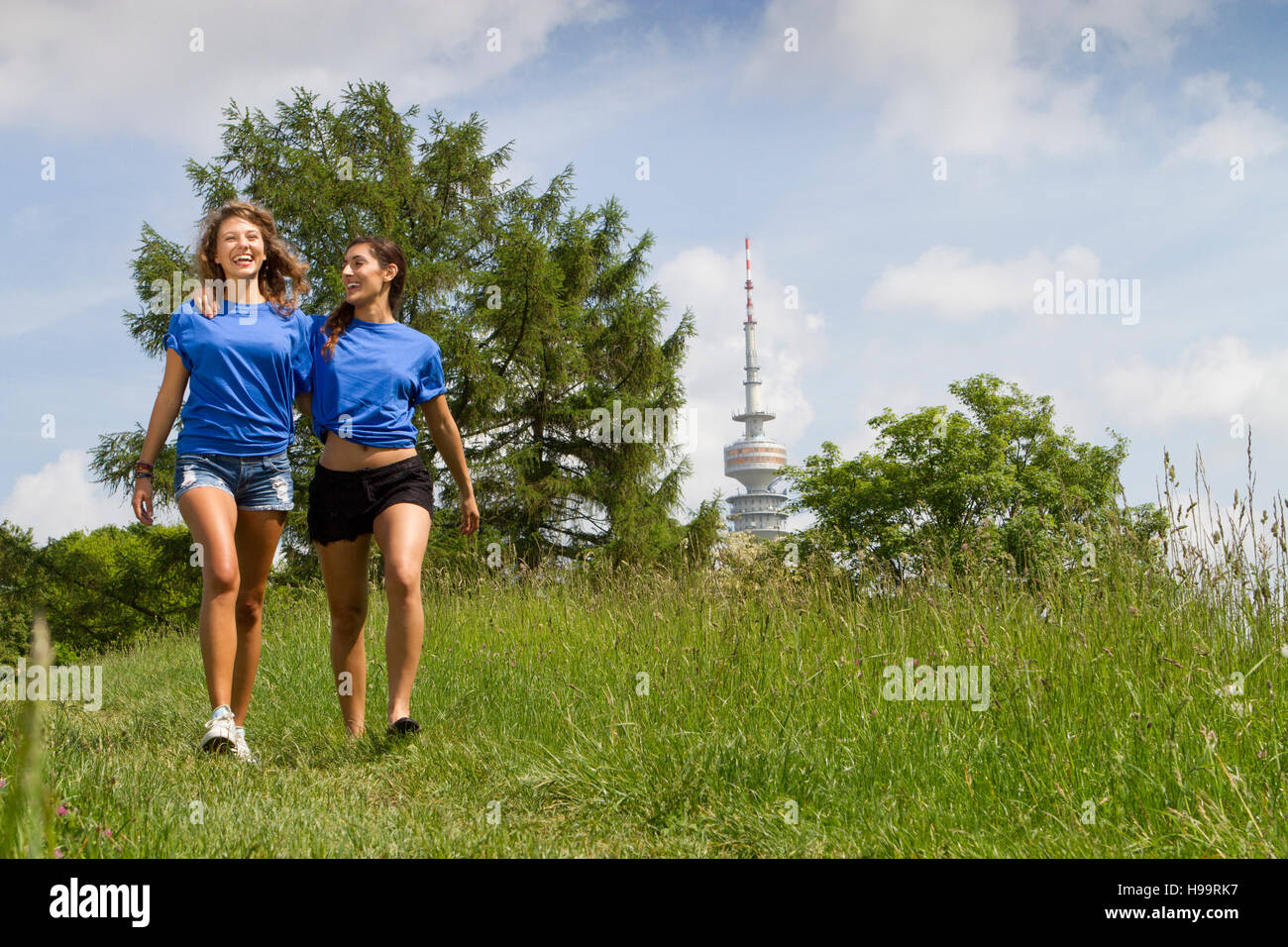 Two young women taking a walk in the countryside Stock Photo - Alamy