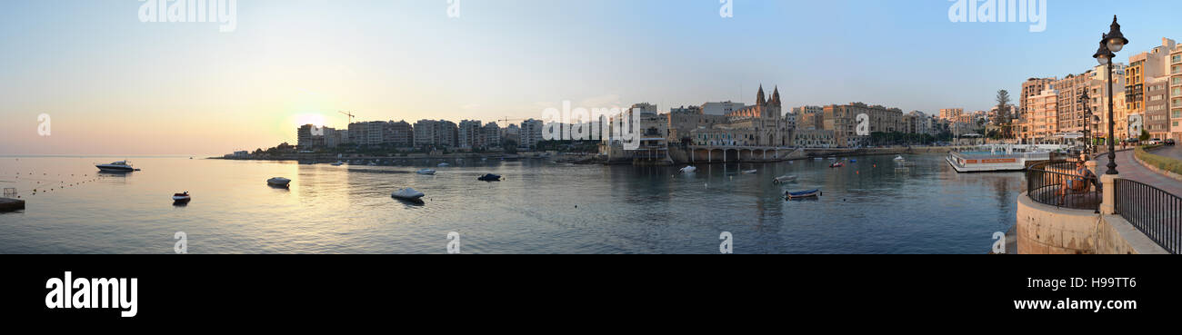Panorama of the Mediterranean villages of Sliema and Balluta Bay, Malta, at sunrise on a sunny Summer day Stock Photo