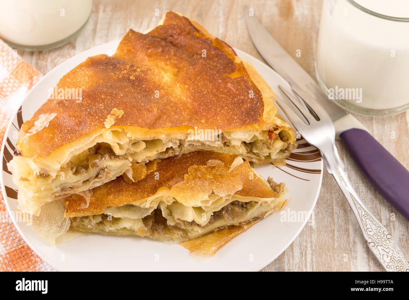 Cheese pie with a yogurt on a glass plate Stock Photo