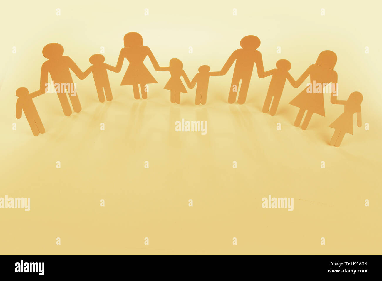 Family paper chain cutout holding hands Stock Photo - Alamy