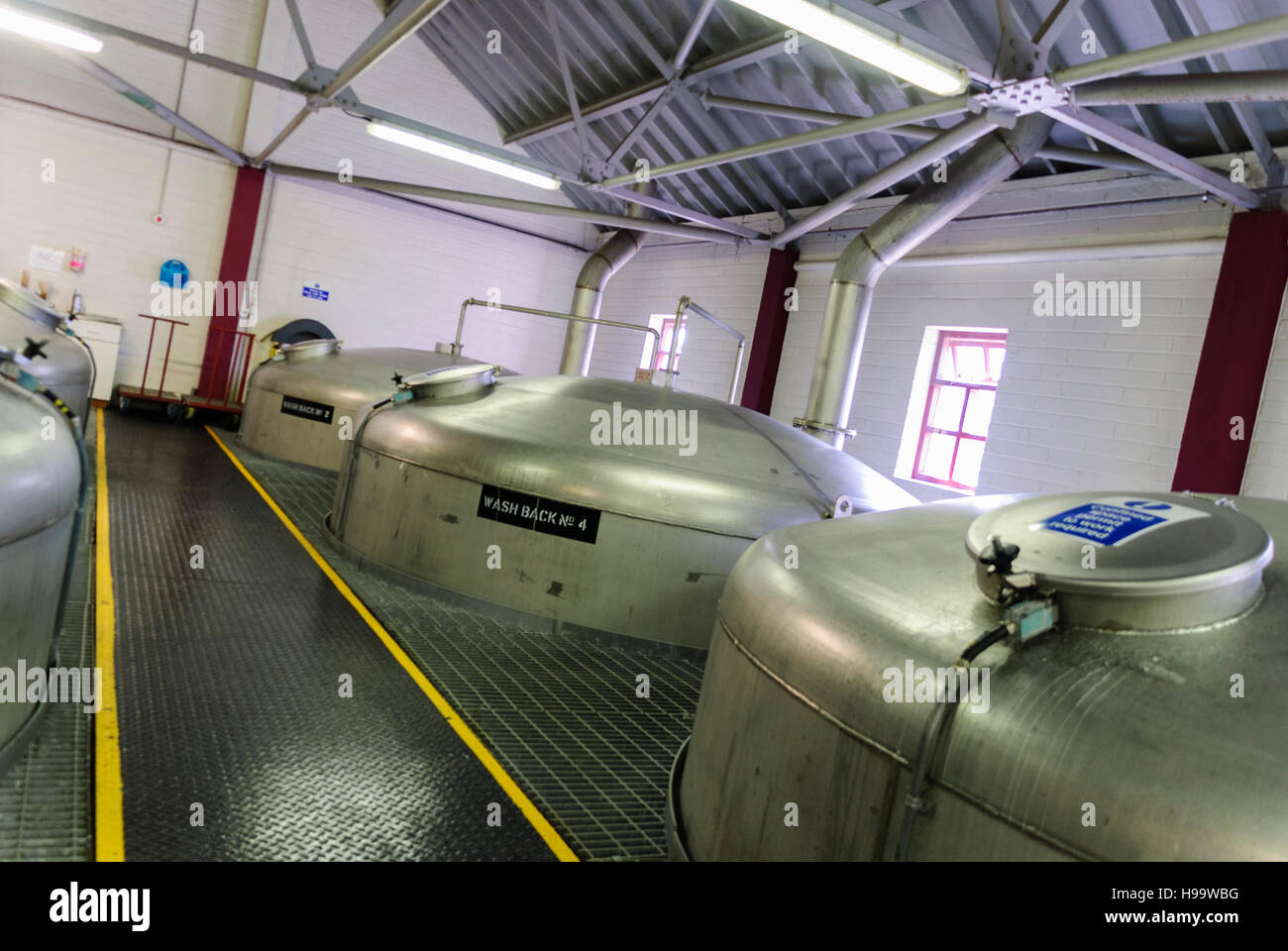Stainless steel fermenting vats inside Bushmills Whiskey Distillery