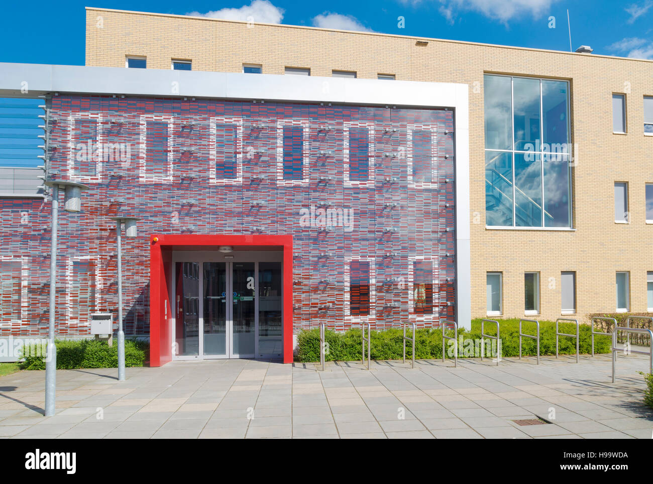 red entrance of a small modern office building Stock Photo