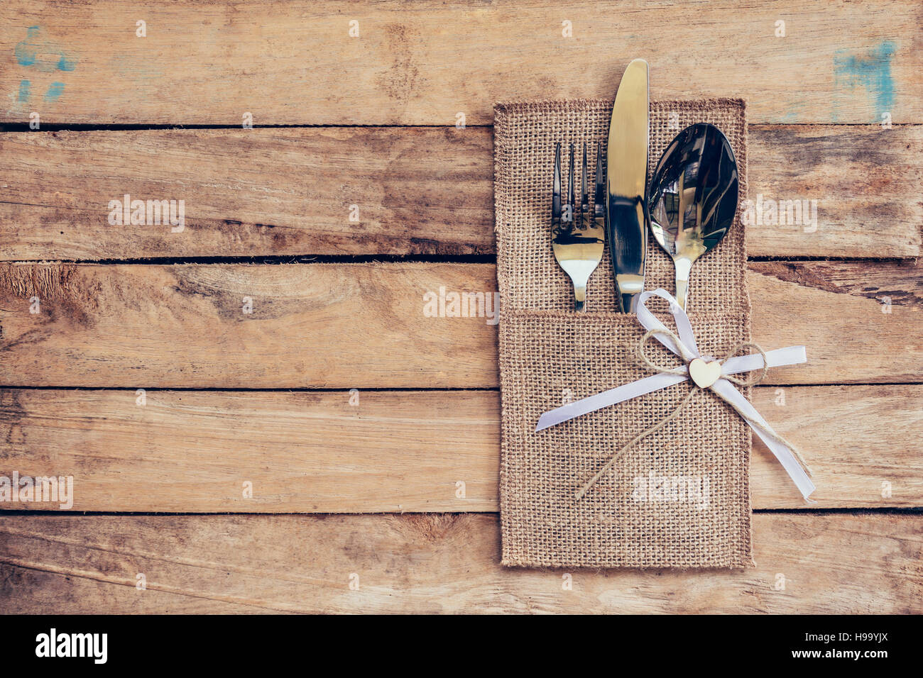 Christmas table place setting and silverware on wood with space and ... Christmas table place setting and silverware on wood with space and ...