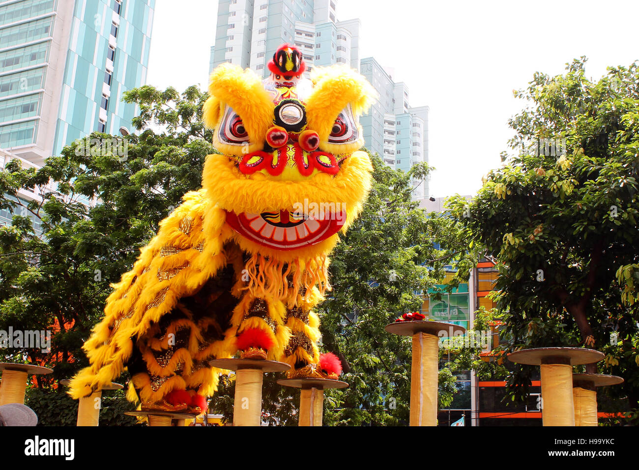 Barongsai or dragon dance in Cap Go Meh carnival which held at Glodok, Jakarta. Played by two people inside the dragon costume. Stock Photo