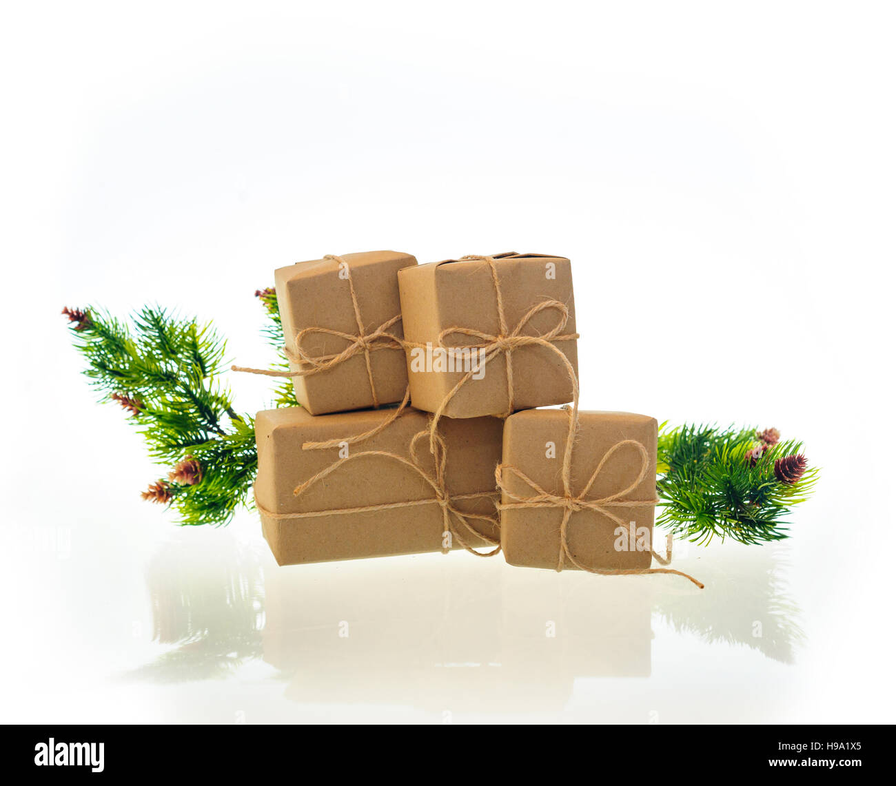Christmas gift boxes with spruce branch on a white background Stock ...