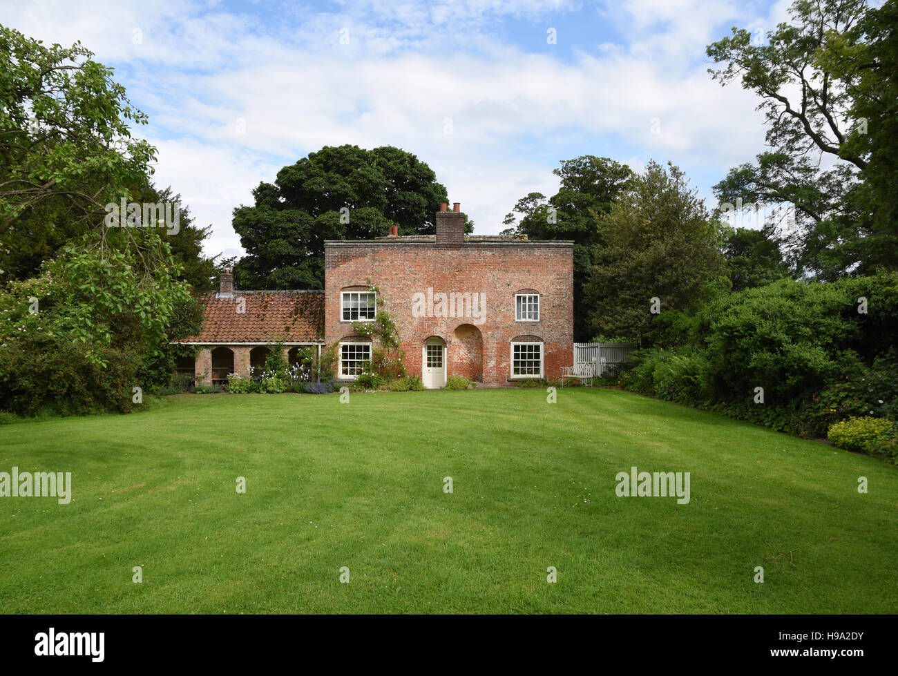 Shandy Hall garden and rear elevation of Laurence Sterne's  house showing his asymmetrical extension at Coxwold, Yorkshire, UK. Stock Photo