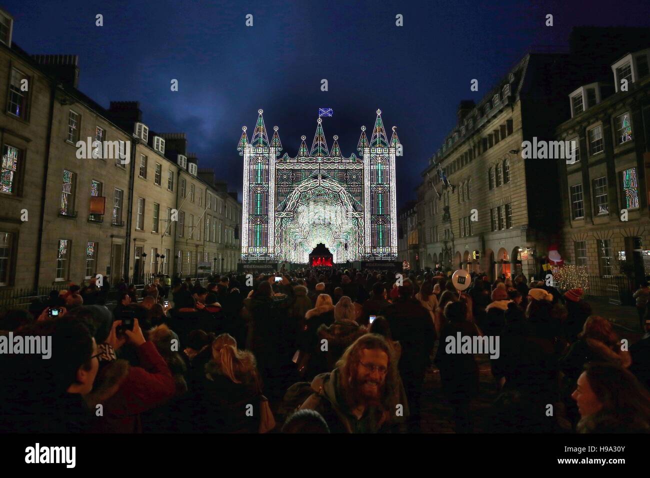 People attend the Light Night event in Edinburgh including the opening of 'Street of Light' on George Street which consists of twenty four arches and has more than 60,000 lights. Stock Photo