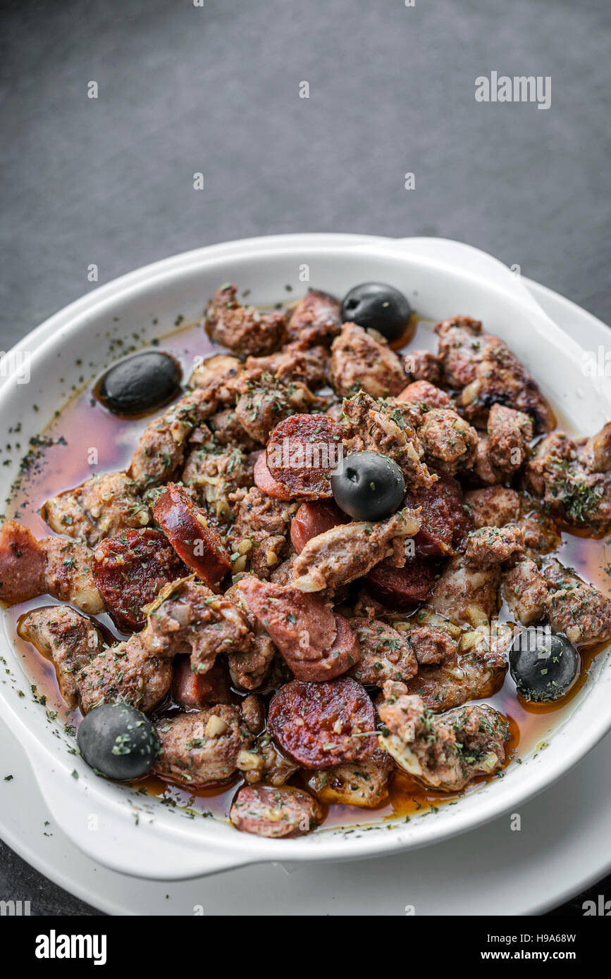 pica pau portuguese spicy sauce pork and sausage traditional tapas snack Stock Photo