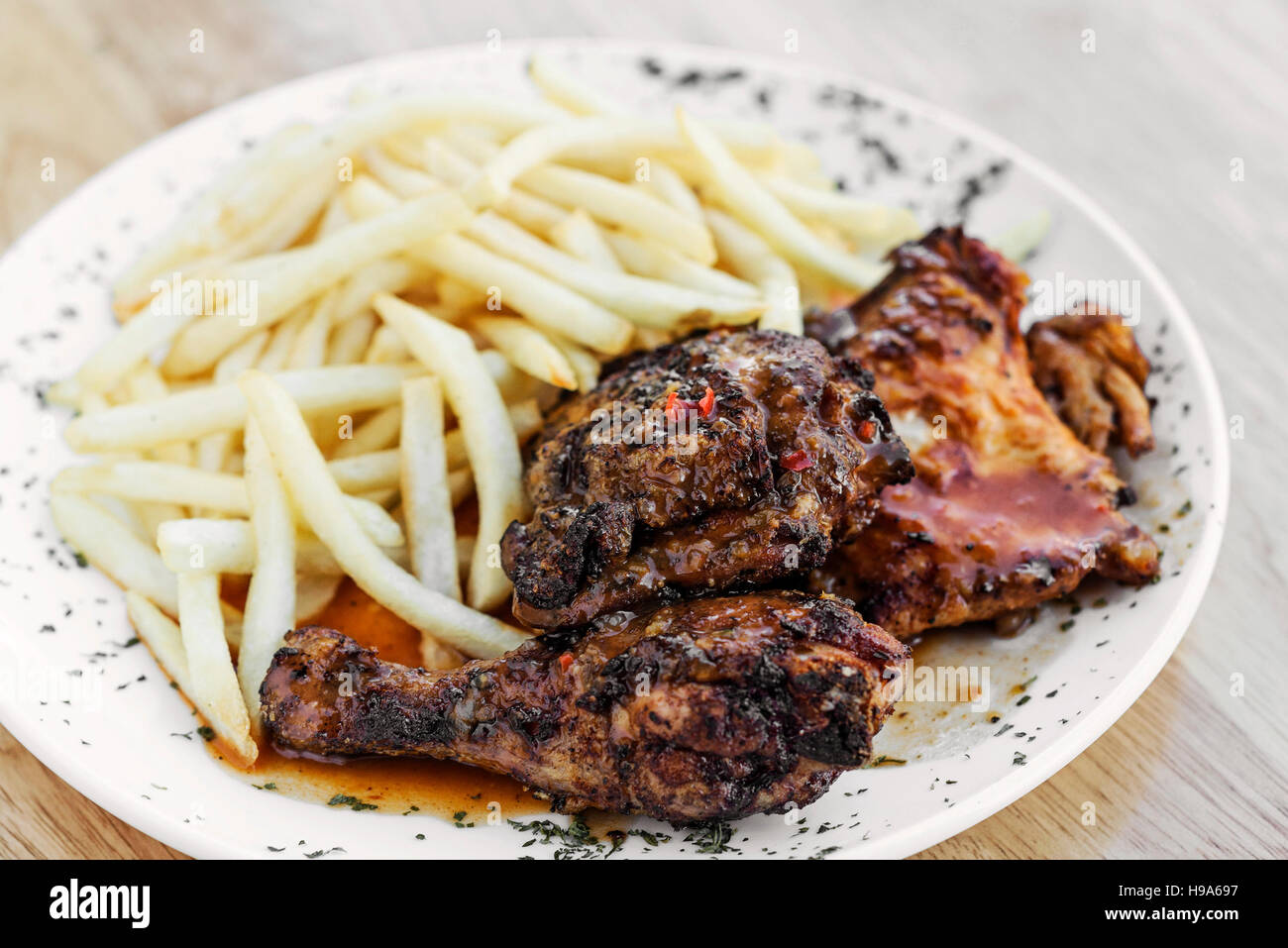 portuguese famous piri piri spicy traditional cuisine bbq chicken with french fries meal Stock Photo