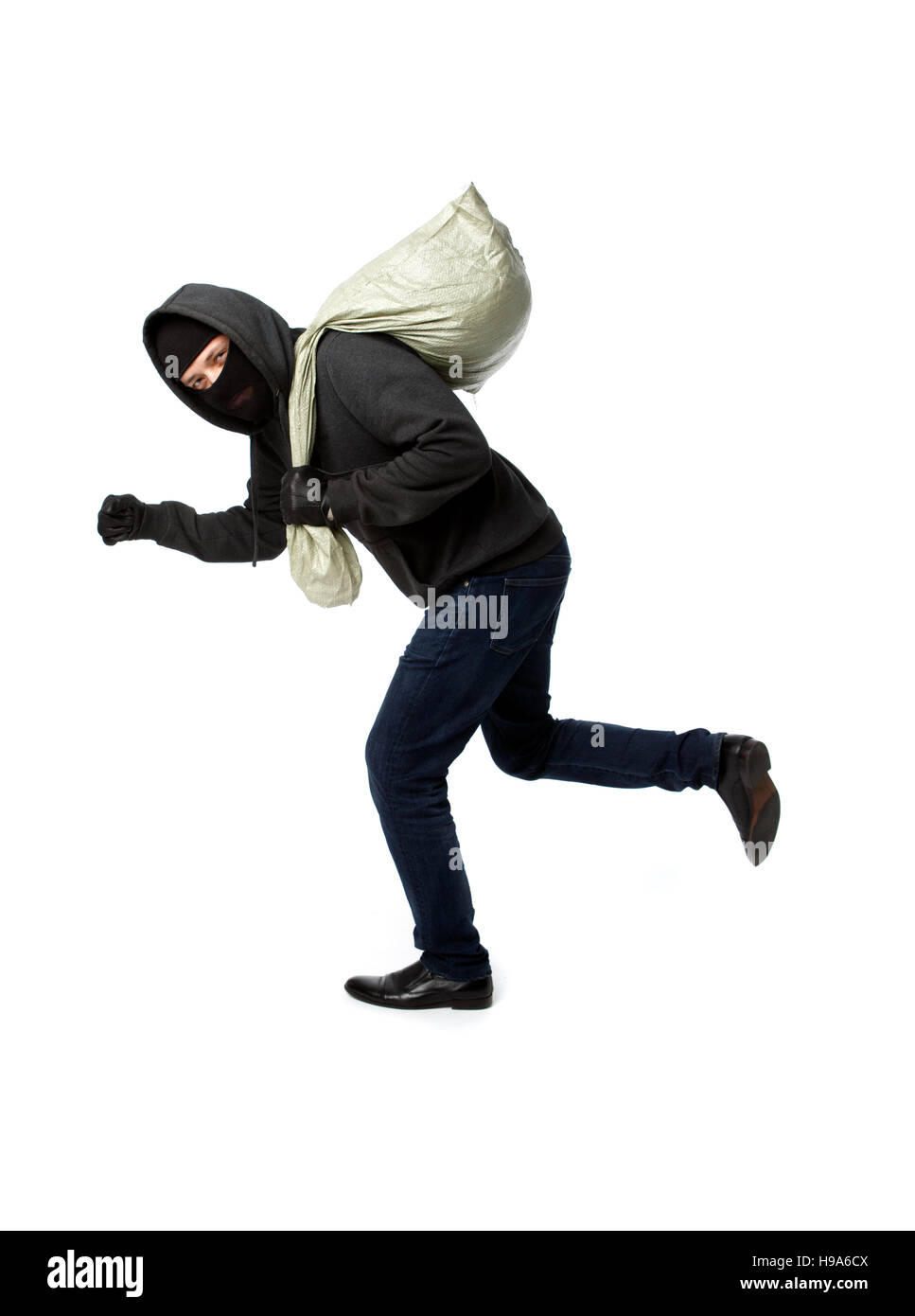 Thief escapes with full bag Stock Photo