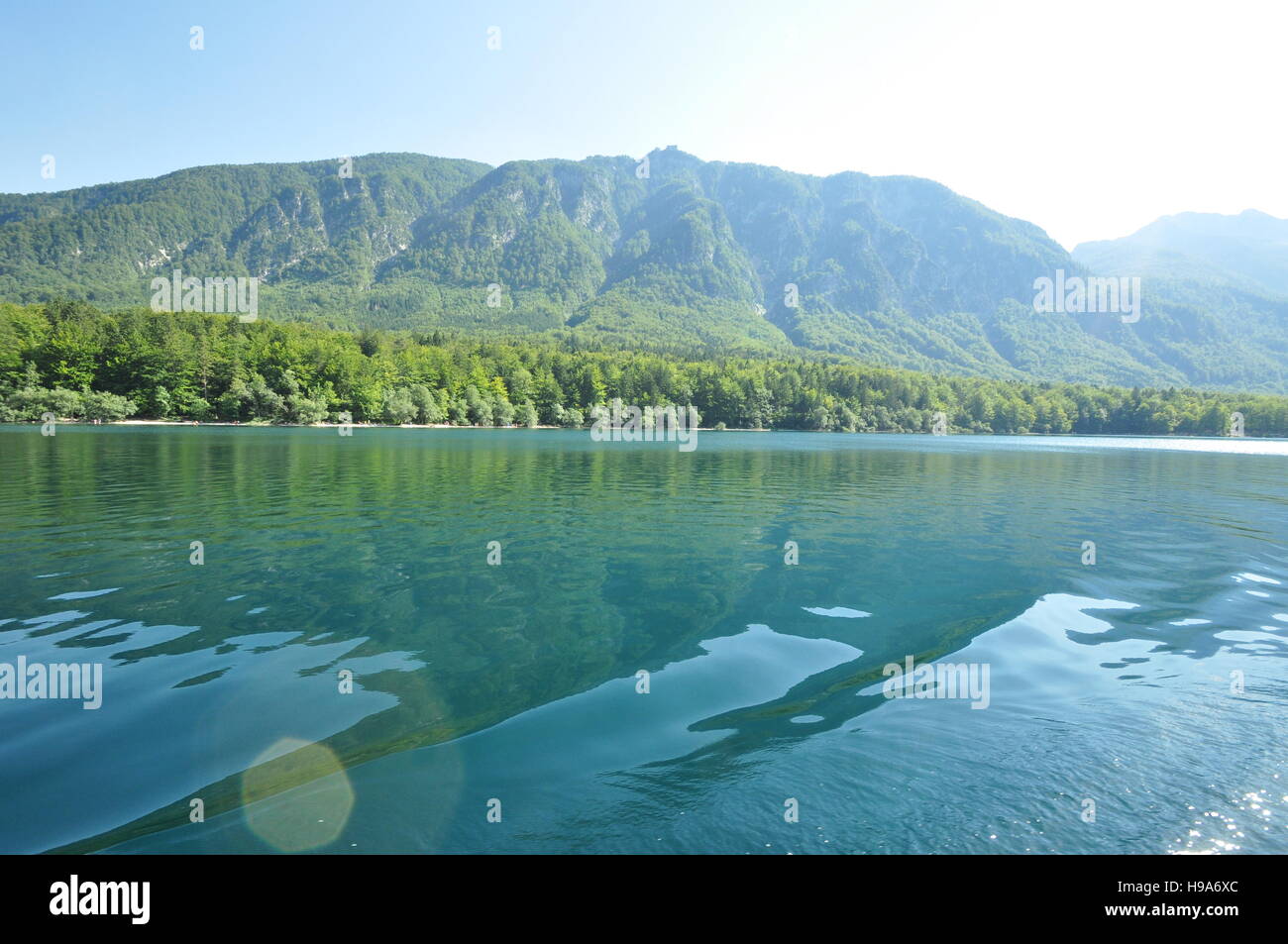 Turquoise waters of Lake Bohinj, Slovenia as seen from a tourist pleasure boat - Stock Image