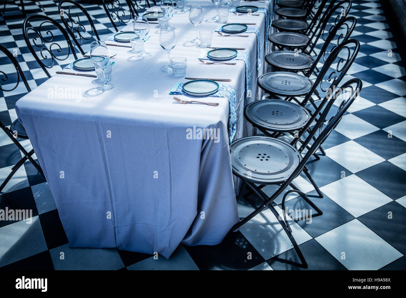 A long table laid out ready for a birthday party at a venue Stock Photo