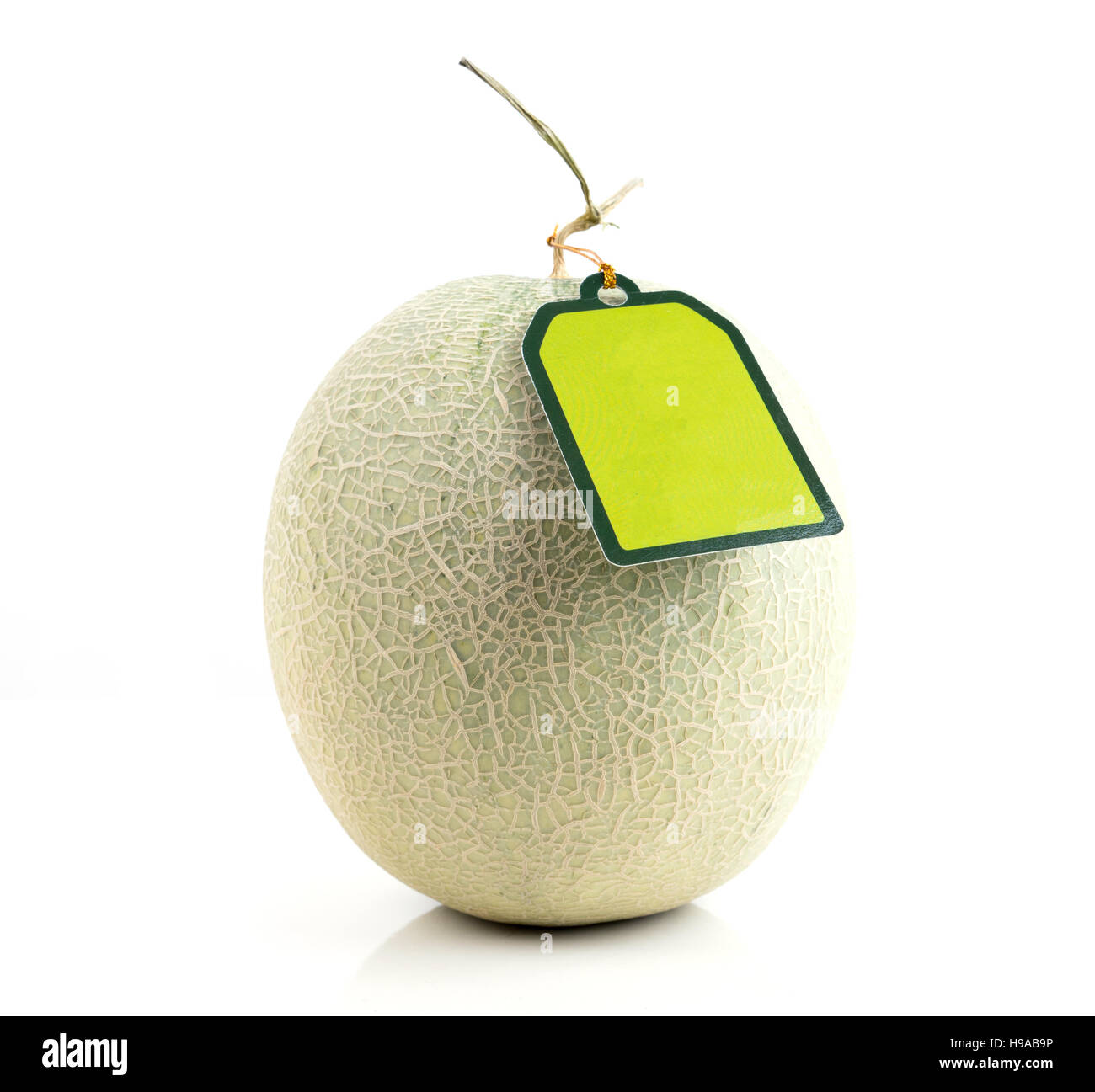 melon with green label tag on white background Stock Photo