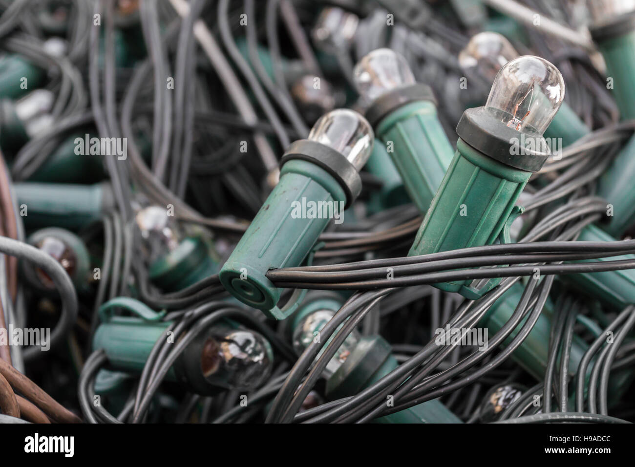 Mess of tangled oldstyle Christmas lights. Shallow depth of field