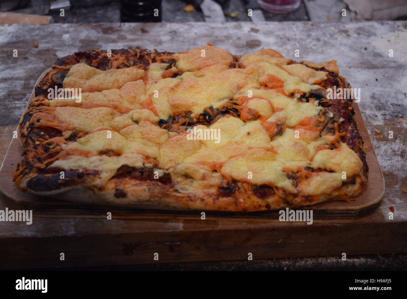 Large rectangular pizza with various ingredients Stock Photo - Alamy