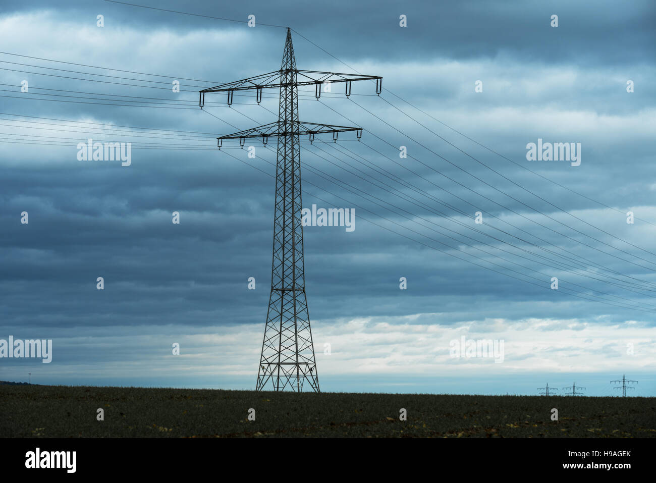 Power transmission high voltage with dramatic blue sky with clouds ...