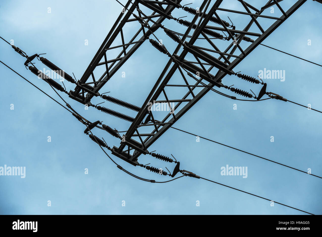 Power transmission high voltage with dramatic blue sky with clouds