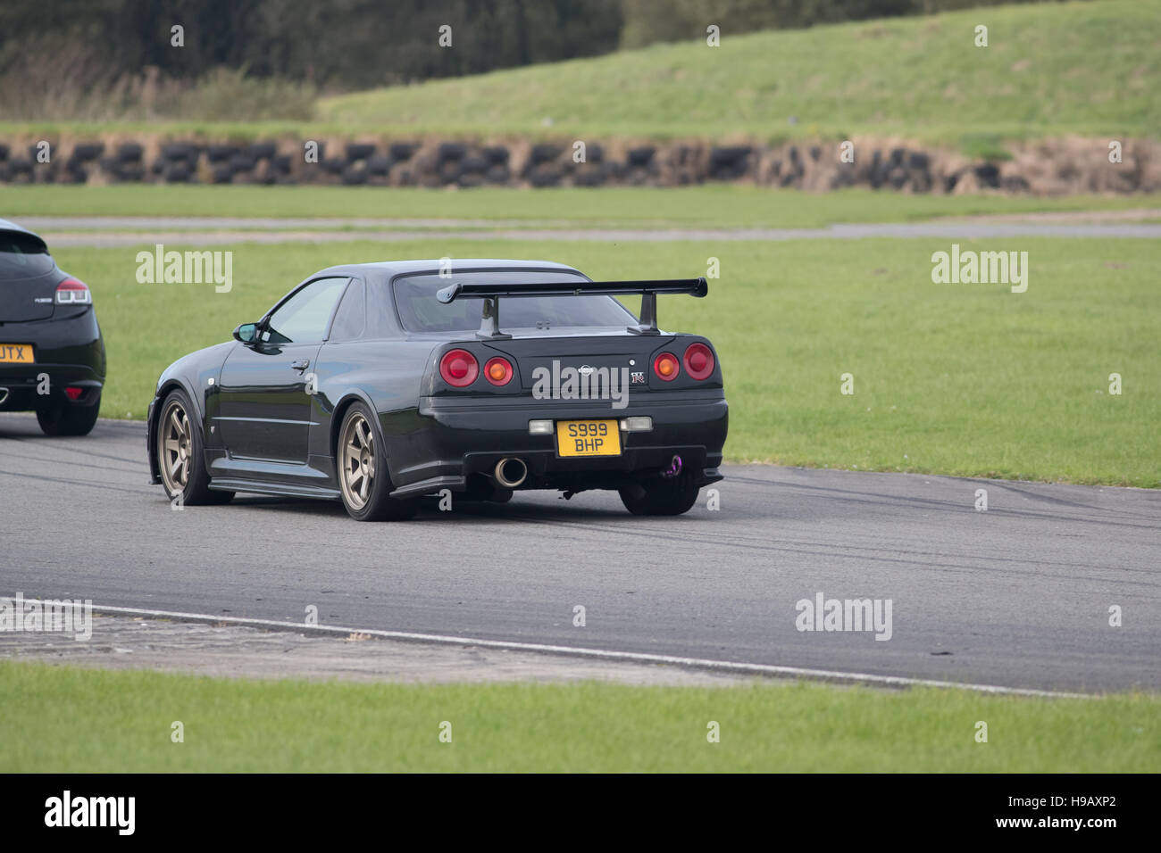 PEMBREY MOTOR CIRCUIT, CARMARTHENSHIRE, UNITED KINGDOM. OCTOBER 8 2016:   Japanese sports car corners at Pembrey Circuit during a track day. Stock Photo