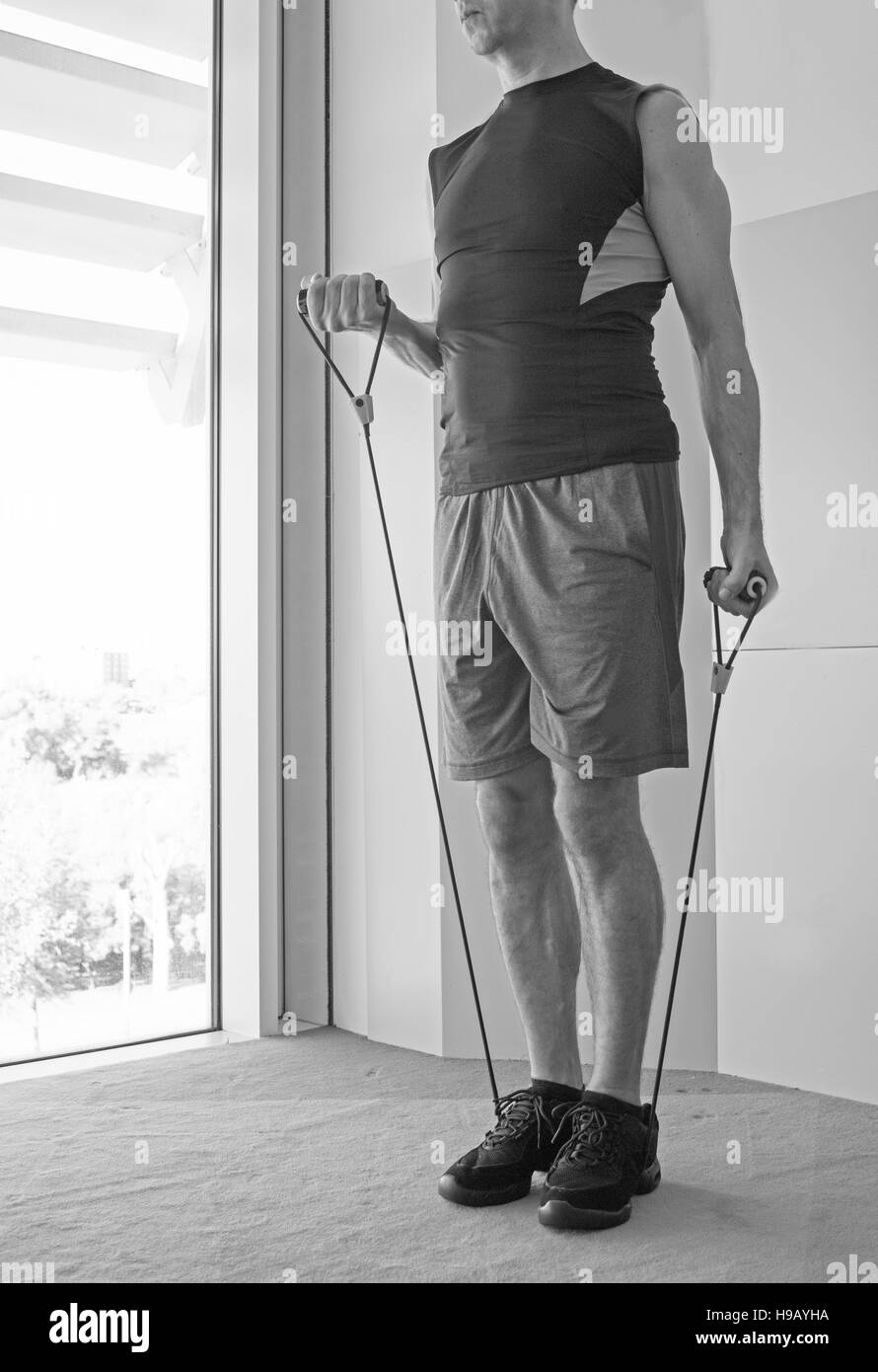 Performing exercises with resistance rope fitness Stock Photo Alamy