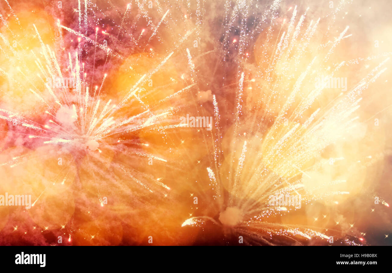 Abstract colorful holiday background of sky with fireworks and stars ...