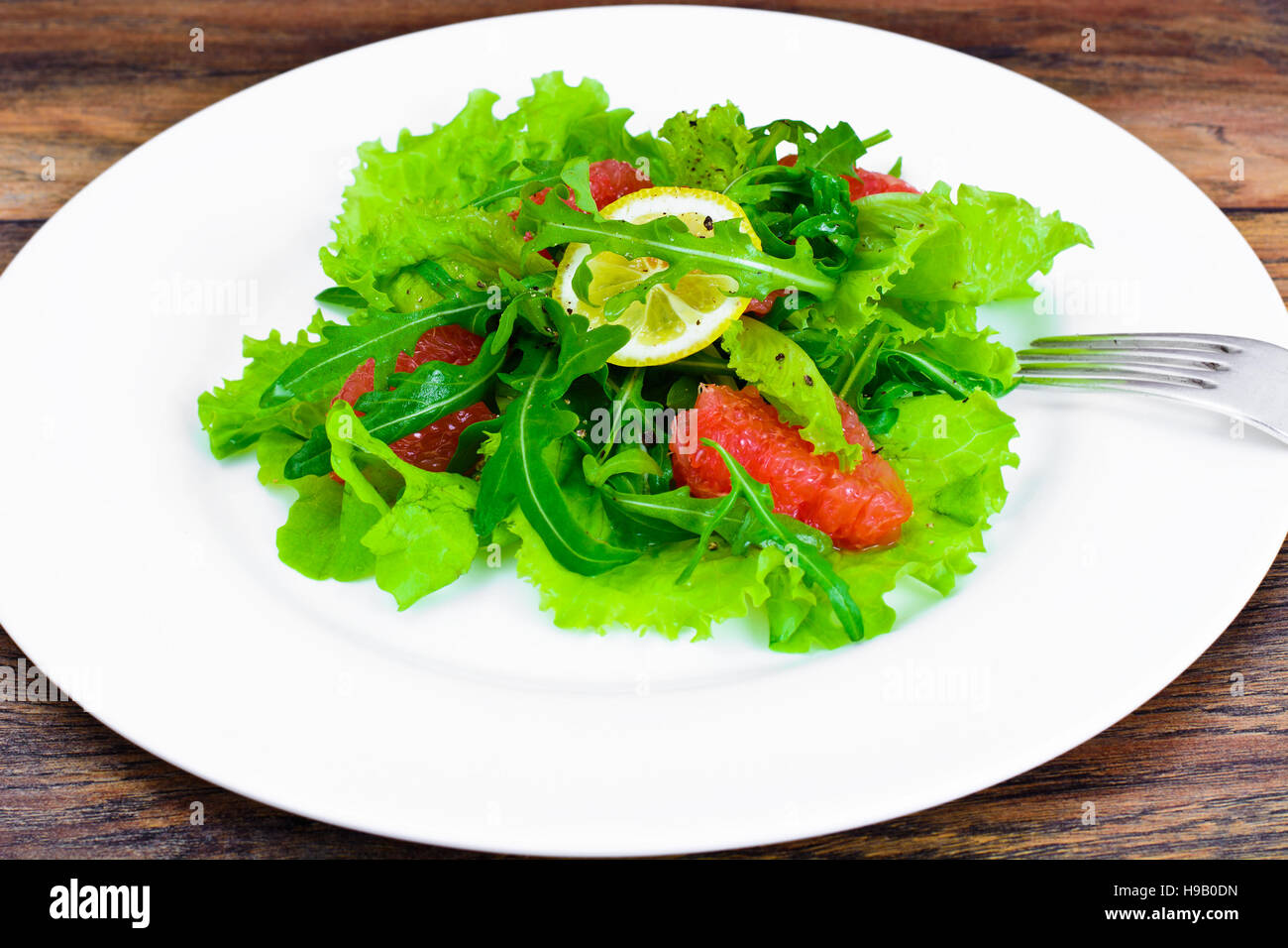 Salad with Mix Batavian, Frise, Radicchio, Chicory, Arugula and Grapefruit Studio Photo Stock Photo