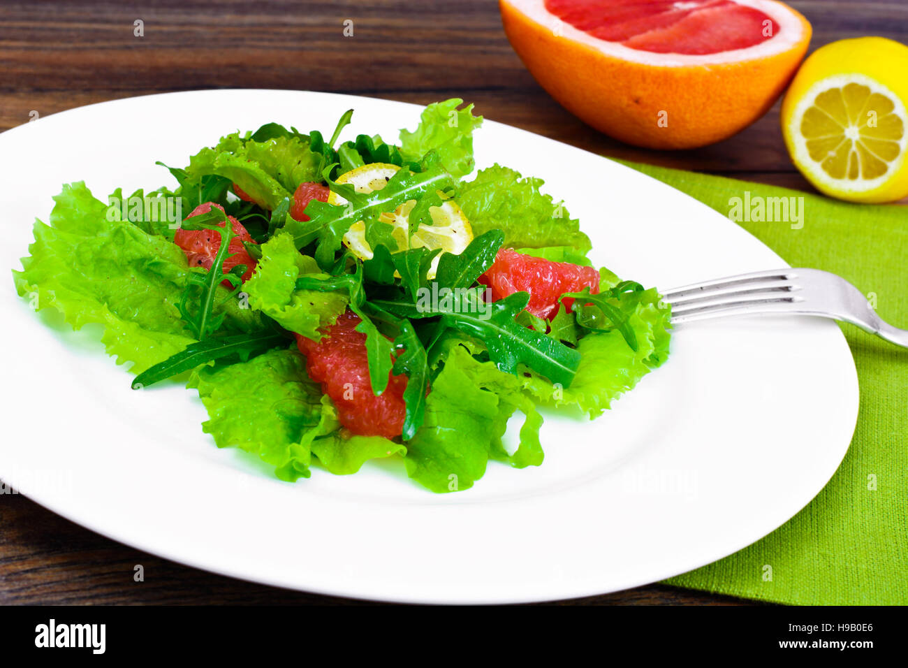 Salad with Mix Batavian, Frise, Radicchio, Chicory, Arugula and Grapefruit Studio Photo Stock Photo