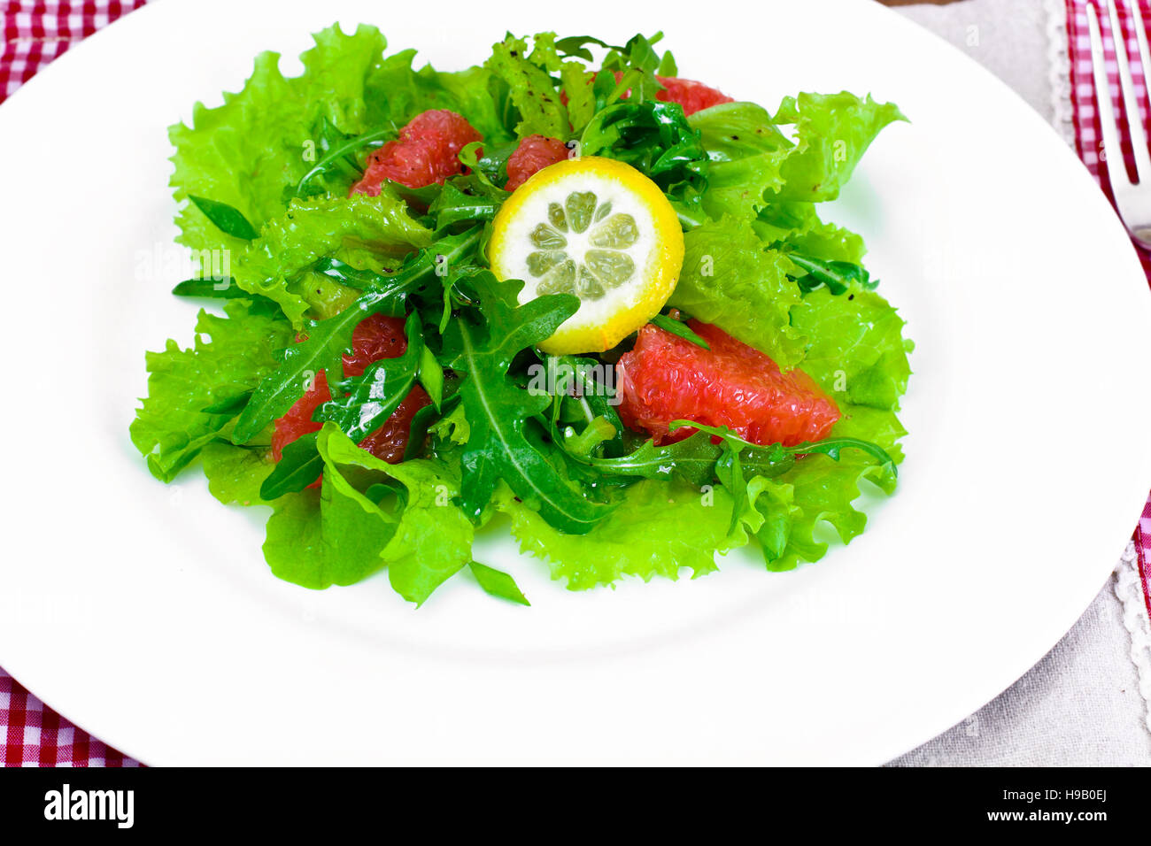 Salad with Mix Batavian, Frise, Radicchio, Chicory, Arugula and Grapefruit Studio Photo Stock Photo