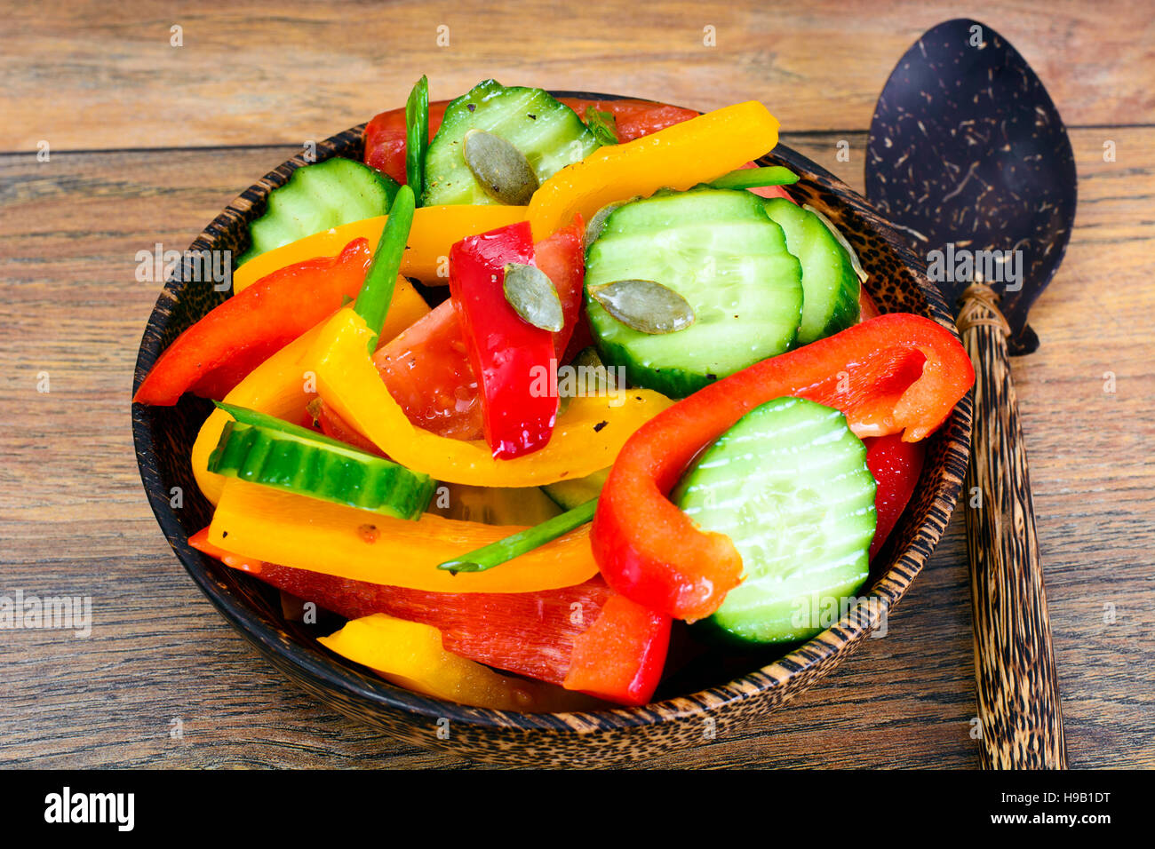 Healthy and diet food Lettuce, tomato, pepper, seeds, oil, salt