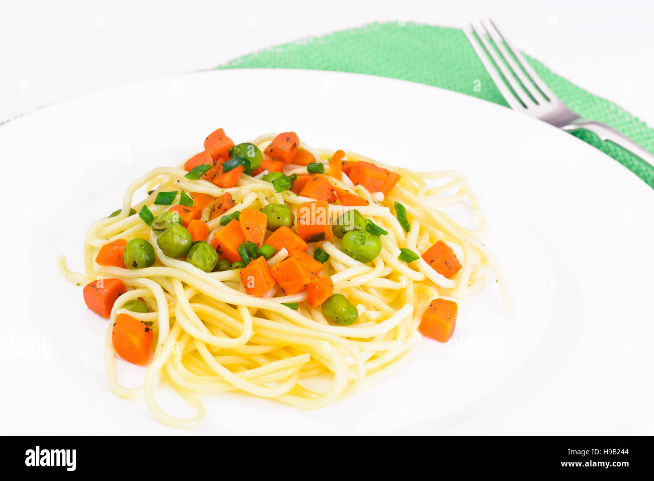 Vegetarian Pasta Spaghetti with Diced Carrots and Green Peas Studio