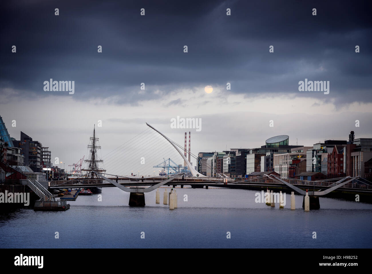 The Samuel Beckett bridge is spaning river Liffey in Dublin , Ireland ...