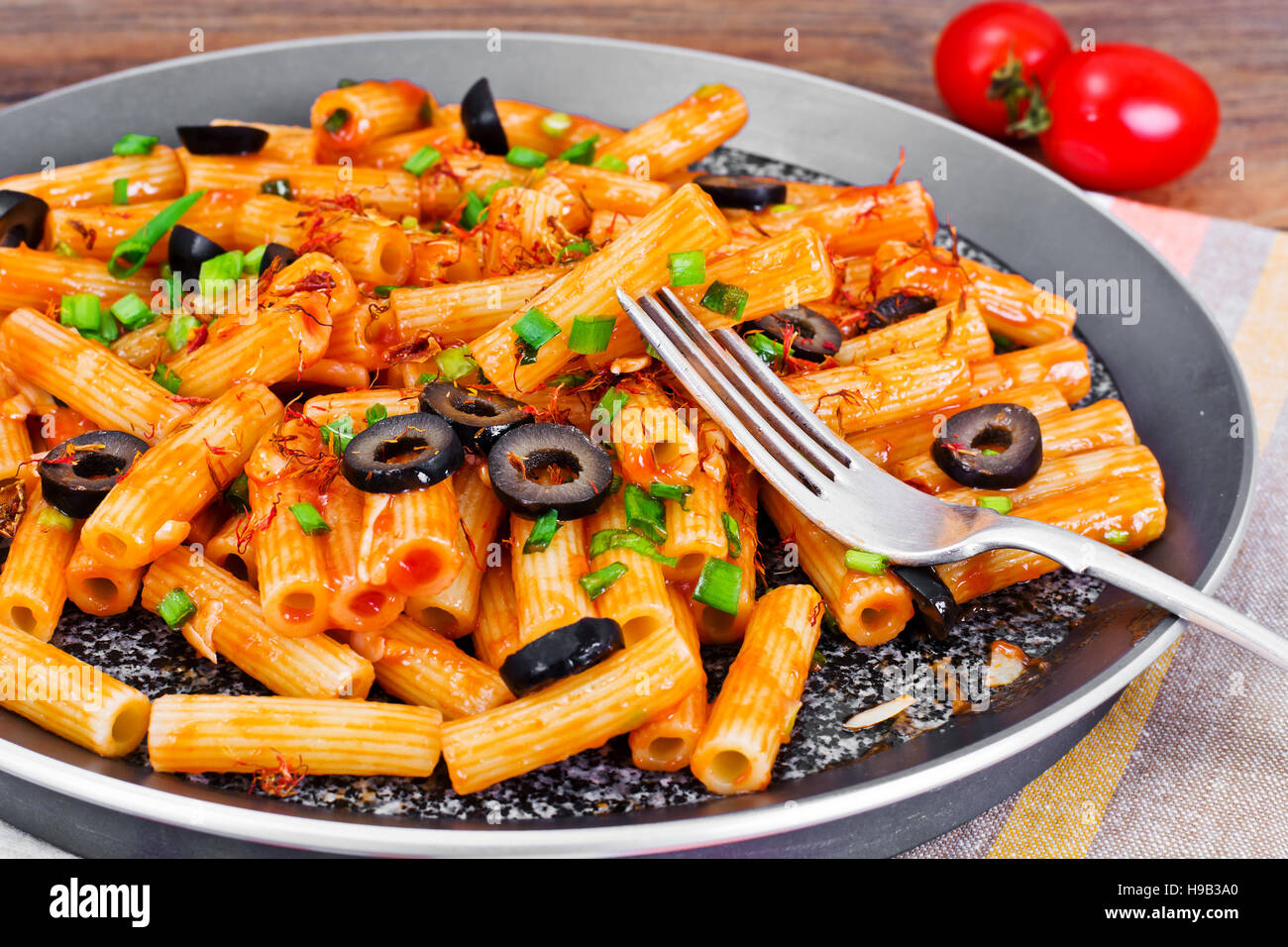 Pasta with Tomato Ketchup Sauce, Green Onions and Cheese Studio Photo
