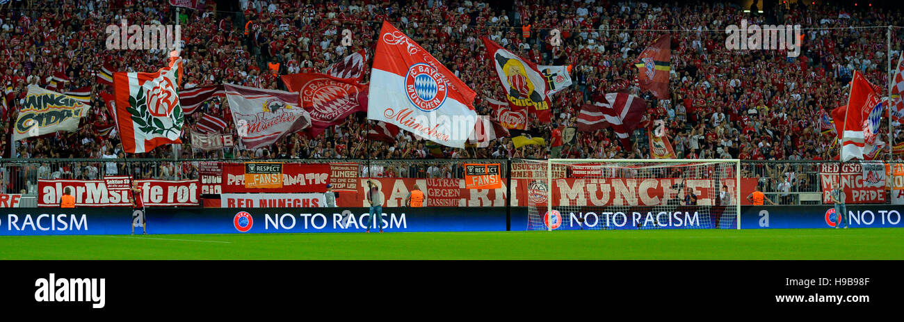 FC Bayern football fans holding flags, Allianz Arena, Munich, Bavaria, Germany Stock Photo