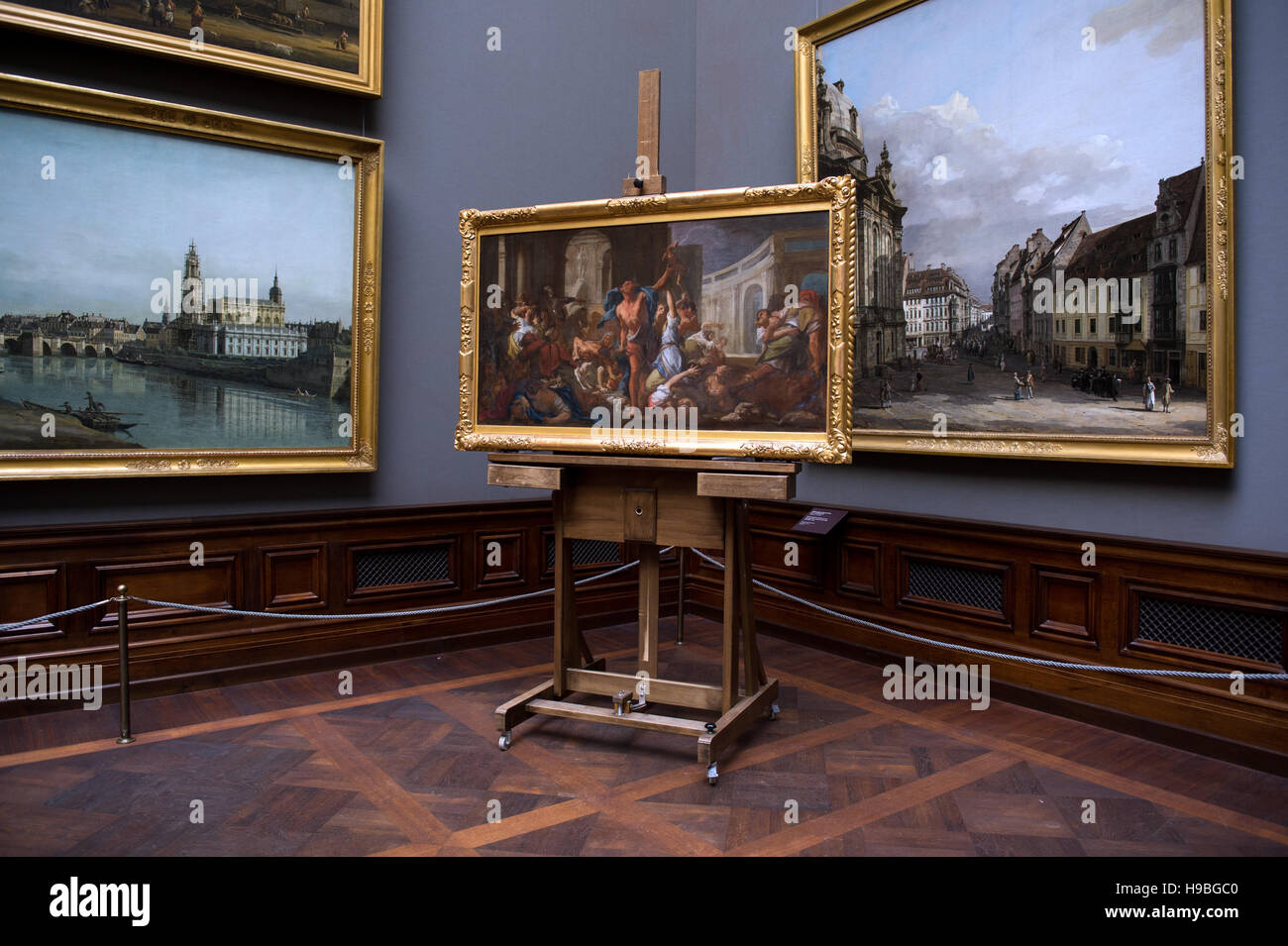 The painting study 'Massacre of the Innocents' by Francesco Trevisani (ca. 1714, 75 x 136cm) stands on an easel in the Old Masters Gallery in Dresden, Germany, 21 November 2016. The Dresden State Art Collections is receiving the painting as a gift from private owners in New York. The oil study is the only known scenic study that shows the original painting (250 x 464cm) in its entirety. The original was displayed in Dresden for over 200 years, but was destroyed in the Second World War. Photo: ARNO BURGI/dpa (ATTENTION EDITORS: Editorial use only in connection with current reporting) Stock Photo