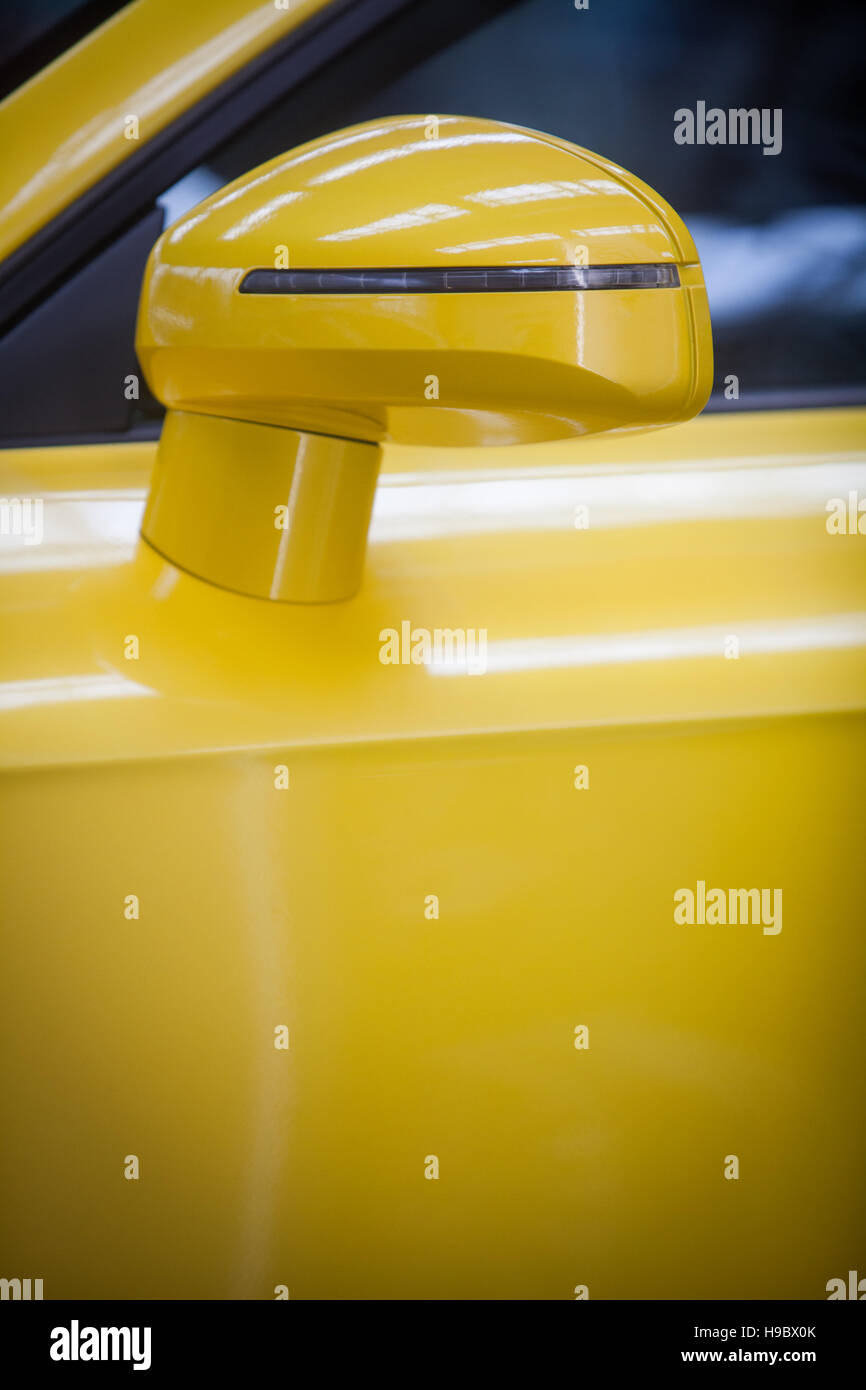 Color image of a yellow modern car side mirror Stock Photo Alamy