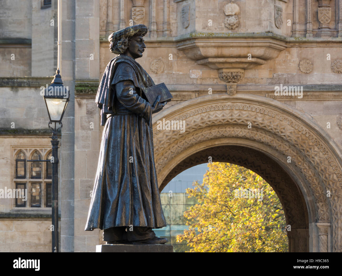 Statue of Raja Ram Mohan Roy, an Indian social reformer with a norman arch behind on College Green in Bristol Stock Photo