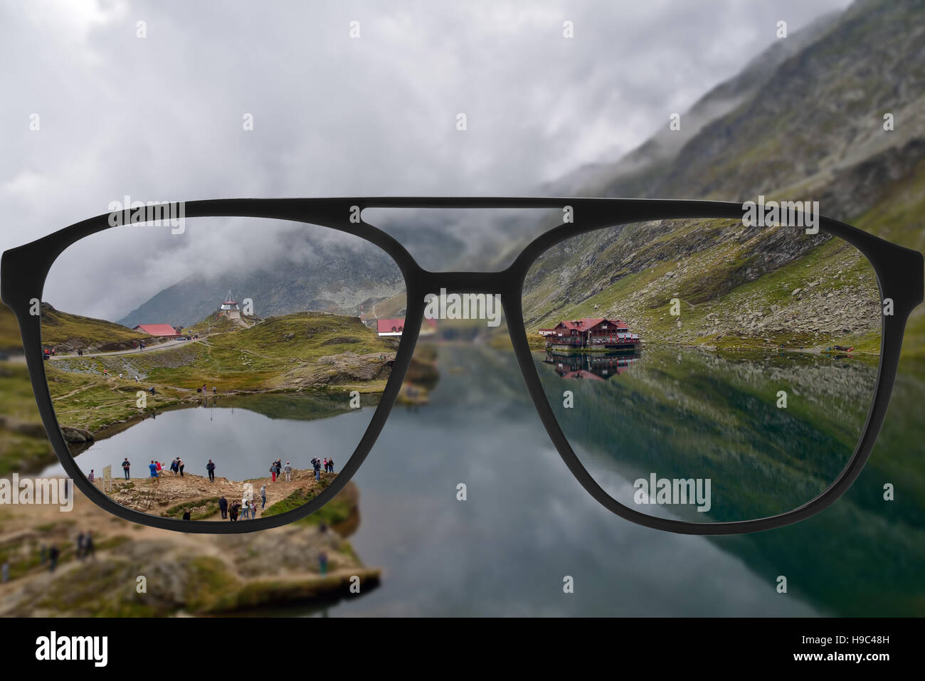 Clear Image In Glasses Against Blurry Landscape Stock Photo Alamy